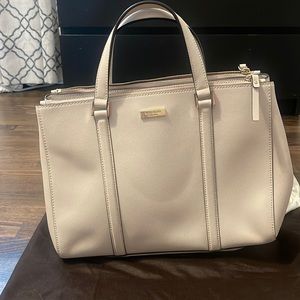 Cream colored leather Kate Spade bag with dust bag.